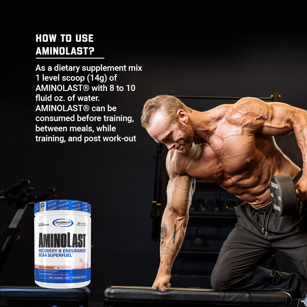 A bodybuilder demonstrating how to use AminoLast Recovery & Endurance BCAA Superfuel during training.